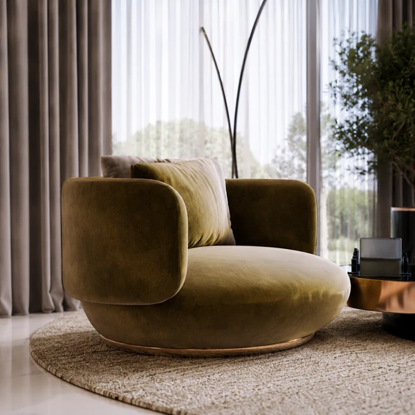 Rounded green upholstered accent chair beside a small table.