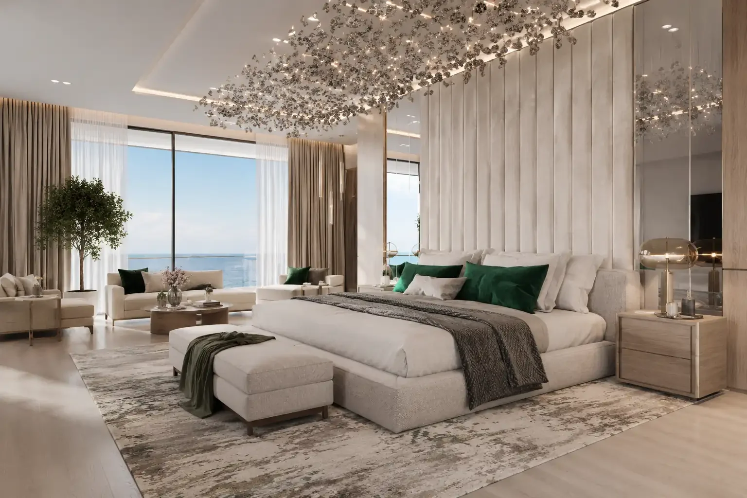Large bedroom with an upholstered bed, bedside cabinets, bench and distant seating area