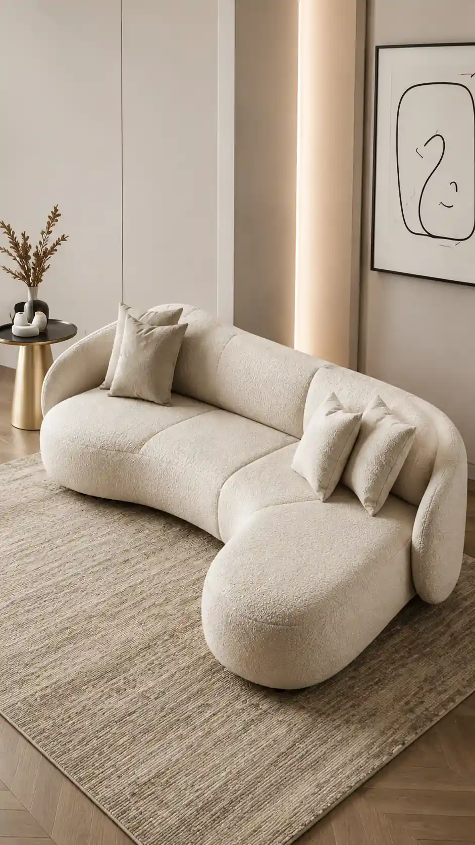Compact pale curved sofa with rounded back and seat forms.
