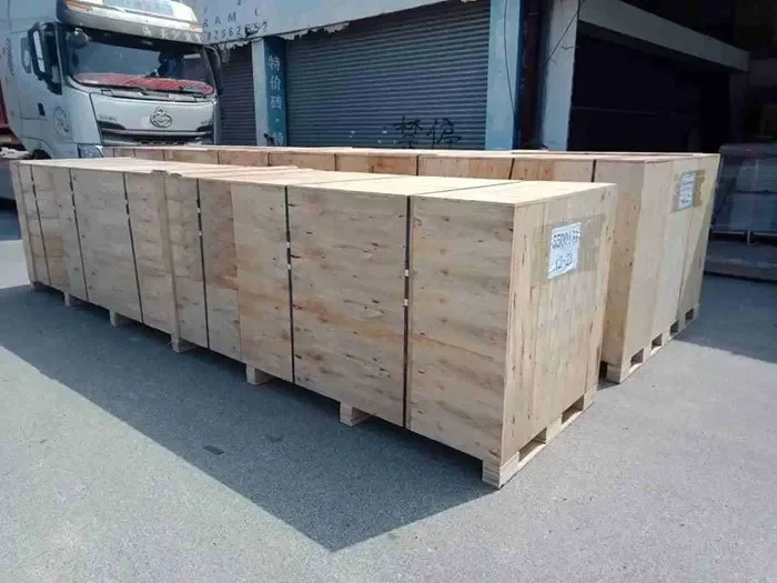 Large timber shipping crate prepared inside a warehouse