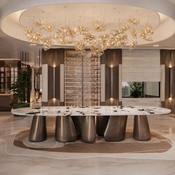 Long oval dining table with a sculptural multi-pedestal base.